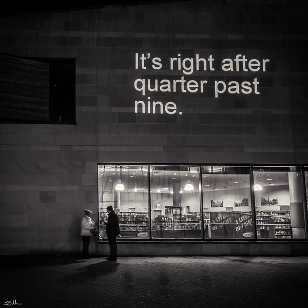 Helvetictoc displayed in Durham, England at night.